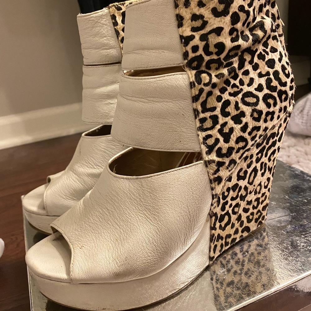 White wedges with animal print detail